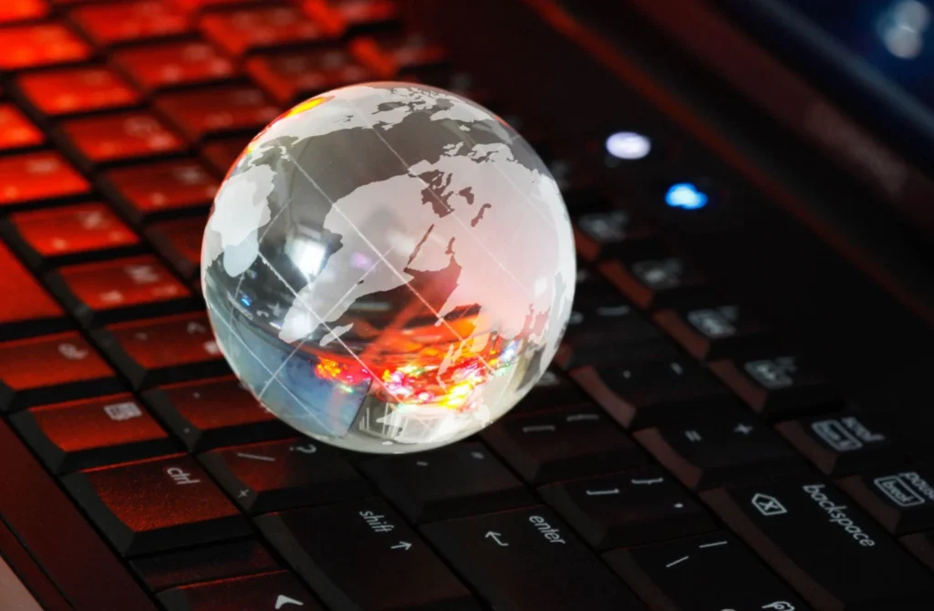 Global Collaboration with image of a globe on top of a computer keyboard